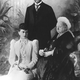 Queen Victoria with her grandson, the future King George V, and his new wife, Mary.